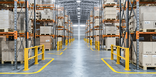 Large warehouse filled with rows of boxes on pallets